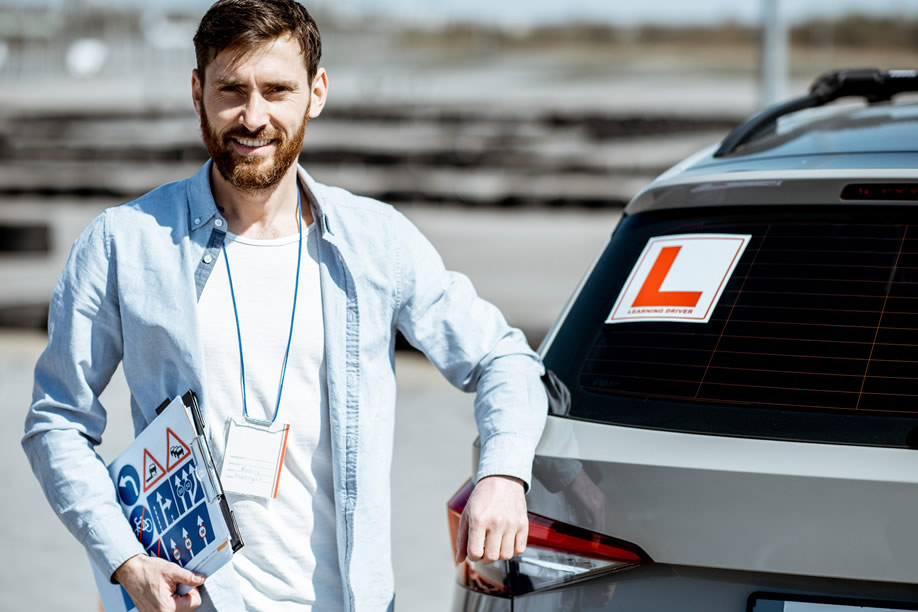 Driving Instructor in front of learner vehicle