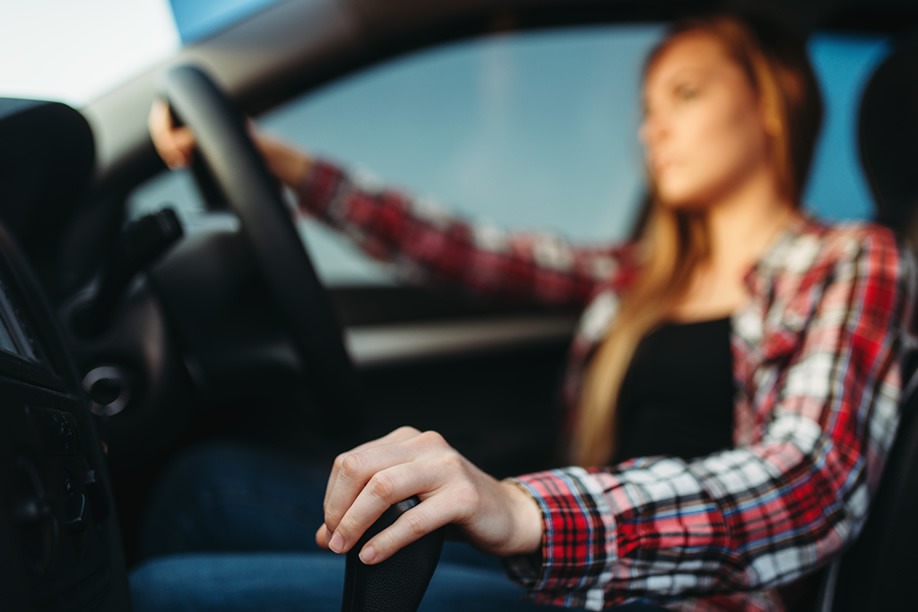 learner driver focused on the gear stick