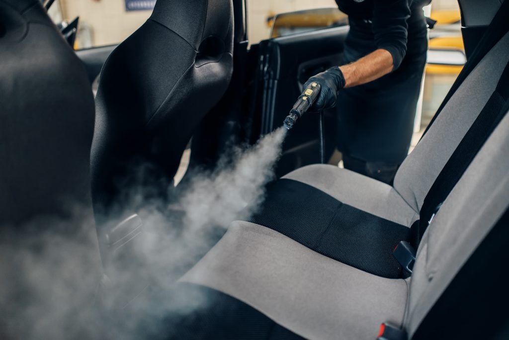 A car getting deep cleaned using specialist equipment (covid-19)