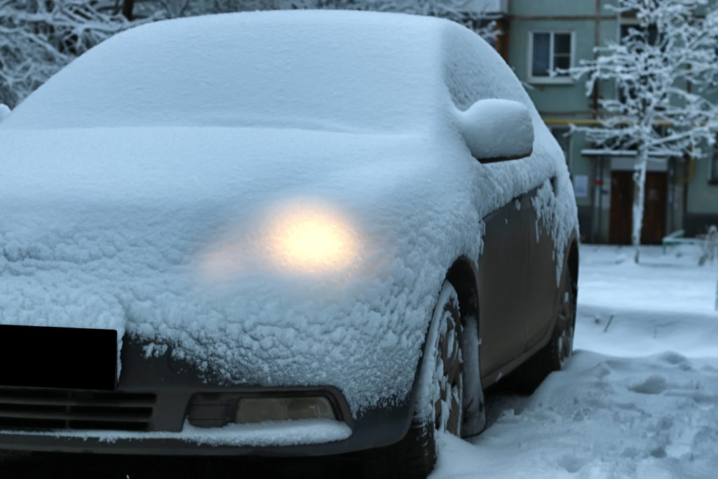 Parked Car Covered in Snow
