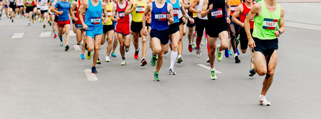 Runners Legs In a Different Coloured Shorts and Vests