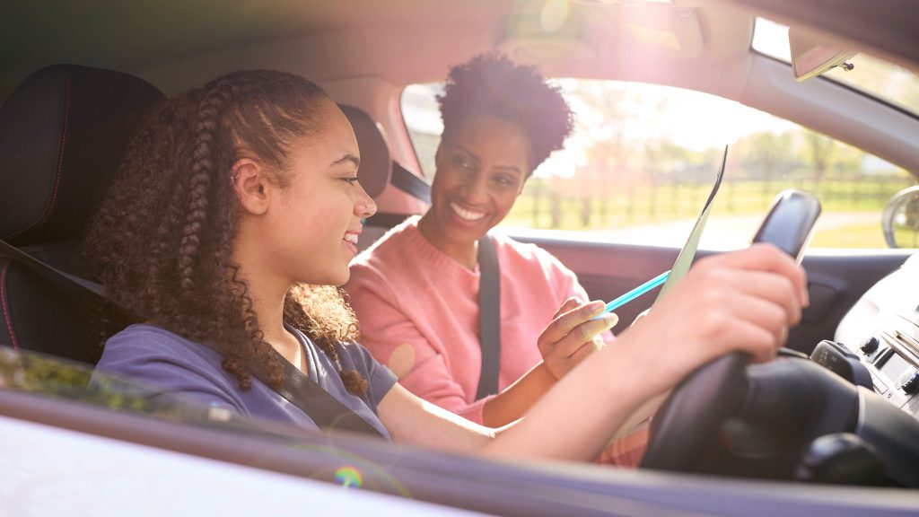 Female instructor supporting a learner driver