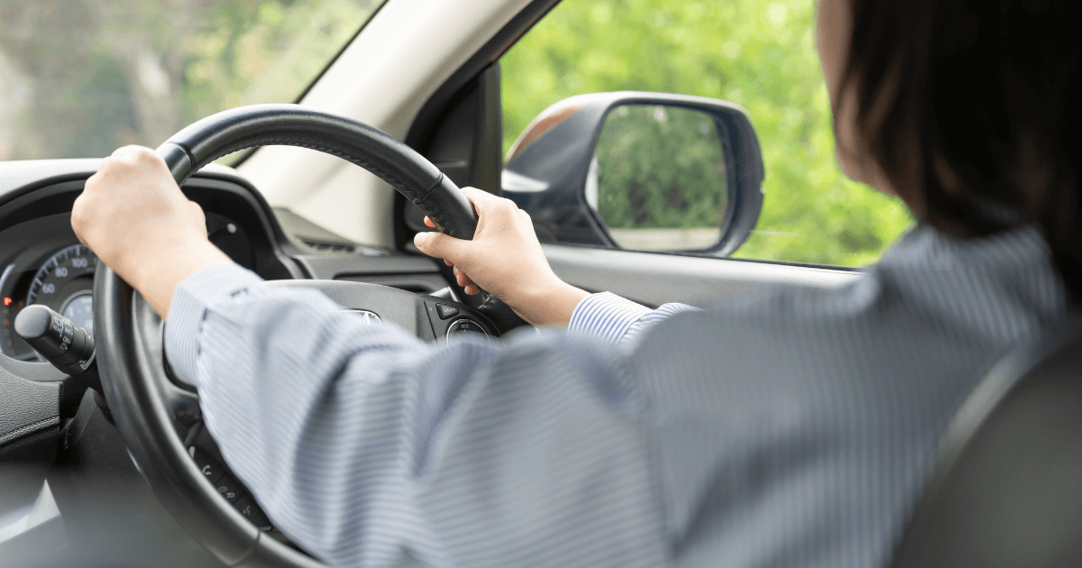 a female driver with steering wheel