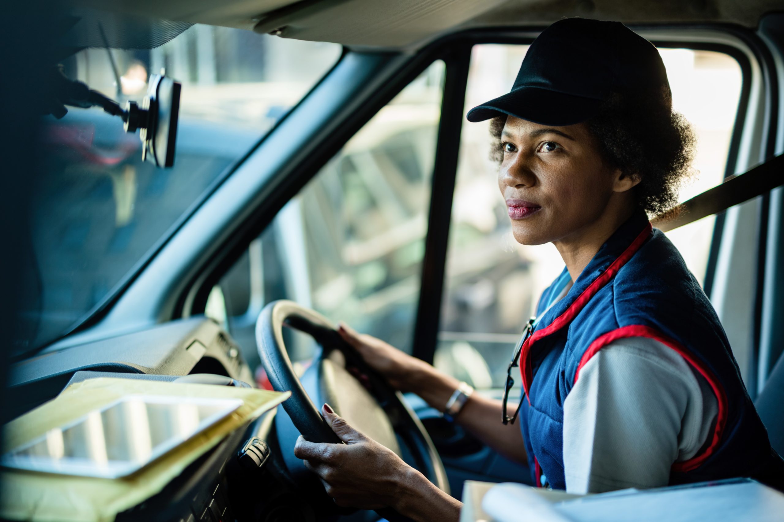 Courier making a food delivery with car in background