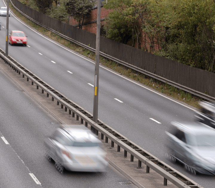 Cars driving fast on motorway
