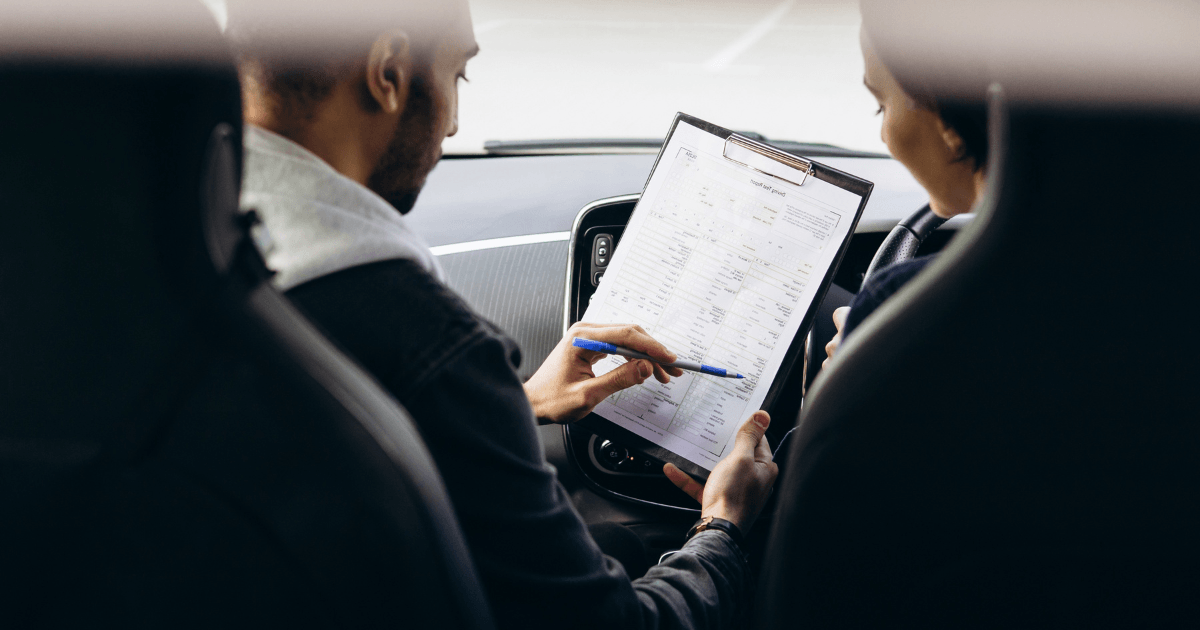 learner driver with test examiner