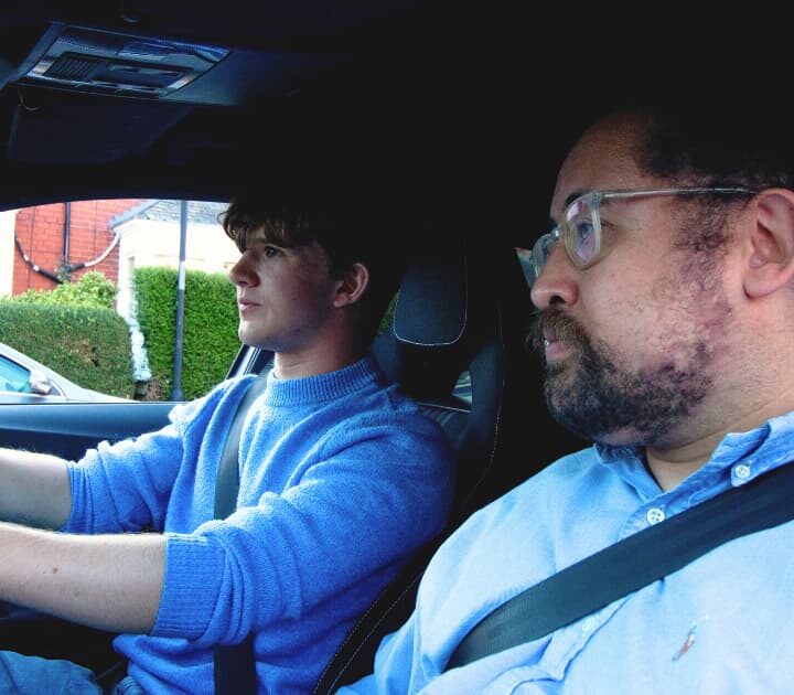 pupil driving car whilst instructor sits next to them on their driving test