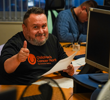 collingwood and children's cancer north thankathon event - member of staff phoning volunteers (2)