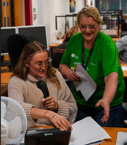 collingwood and children's cancer north thankathon event - two female staff calling volunteers