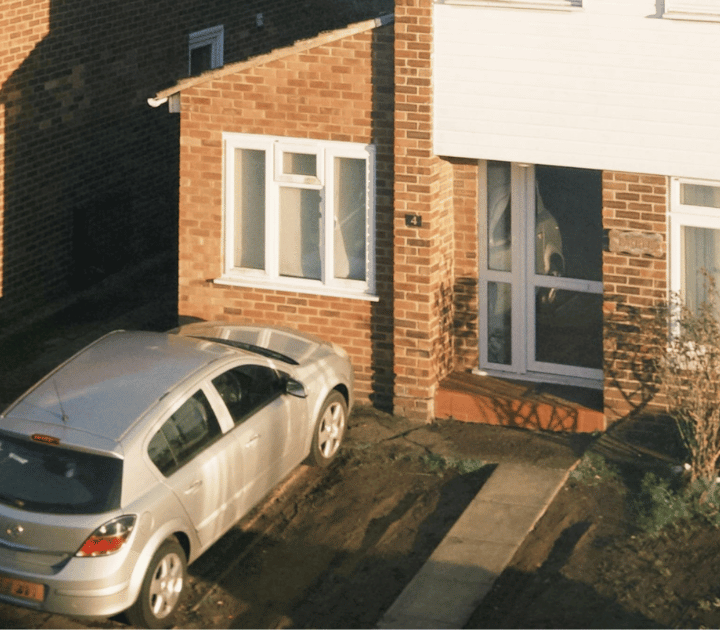 silver vauxhall parked on a drive outside of a home